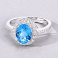 2 Ct Oval Swiss Blue Topaz and Lab Diamond Prong Silver Halo Pave Ring by Fine Color Jewels