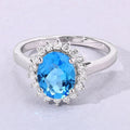 2 Ct Oval Swiss Blue Topaz and Lab Diamond Prong Silver Halo Ring by Fine Color Jewels