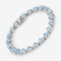 Heart Blue Topaz Prong Silver Tennis Bracelet by Fine Color Jewels