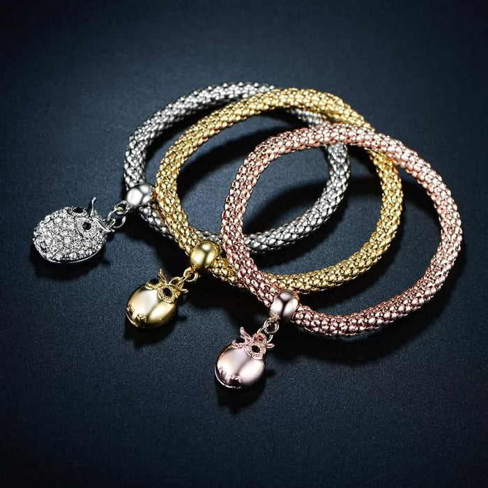 3-Piece: 18K Tri-Tone Owl Charm Stretch Popcorn Bracelet Set by DailySale