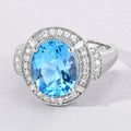 4 Ct Oval Swiss Blue Topaz and Lab Diamond Silver Halo Statement Ring by Fine Color Jewels