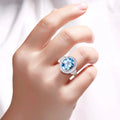 4 Ct Oval Swiss Blue Topaz and Lab Diamond Silver Halo Statement Ring by Fine Color Jewels