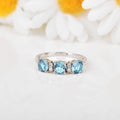Three Stone Blue Topaz Ring by Fine Color Jewels