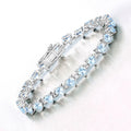 Heart Blue Topaz & Diamond Prong Silver Tennis Bracelet by Fine Color Jewels