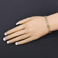 Oval Green Peridot Prong Two-Tone Gold Plated Silver Infinity Bolo Adjustable Bracelet by Fine Color Jewels