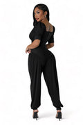 Black Ribbed Stretch Jumpsuit by The House of Stylez