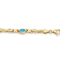 Oval Swiss Blue Topaz Bezel 10K Yellow Gold Fancy Link Bracelet by Fine Color Jewels