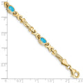Oval Swiss Blue Topaz Bezel 10K Yellow Gold Fancy Link Bracelet by Fine Color Jewels