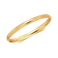 14k Yellow Gold Dome Style Children's Bangle with Diamond Cuts by Avera Group