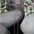 14k Rose Gold Round Cable Link Chain (1.25 mm) by Avera Group