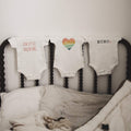 graphic bodysuit | loved rainbow heart by Finn + Emma