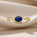 0.53 Ct Oval Blue Sapphire and White Sapphire Prong 22k Gold Vermeil Three Stone Promise Ring by Fine Color Jewels