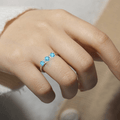 Three Stone Blue Topaz Ring by Fine Color Jewels
