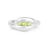 0.56 Ct Oval Green Peridot Channel Silver Three Stone Bypass Ring