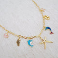 Ocean Play Charm Necklace – Dolphin, Starfish & Shell