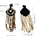 Black and Gold Tassel Drop Earrings by Duma Mbili LLC