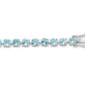 Round Swiss Blue Topaz Prong Sterling Silver Tennis Bracelet by Fine Color Jewels