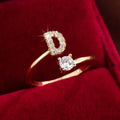 Adjustable Copper Initial Ring with Four-Claw Round Zirconia by DailySale