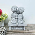 Boy Kissing Girl Statue Sitting on Bench Figurine by DailySale