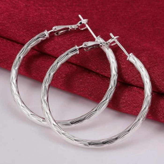 Diamond Cut Hoop Earrings In White Gold by DailySale