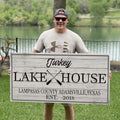 Family Lake House Paddle Sign by Tailored Canvases