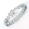 Heart Blue Topaz & Diamond Prong Silver Tennis Bracelet by Fine Color Jewels