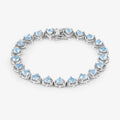 Heart Blue Topaz Prong Silver Tennis Bracelet by Fine Color Jewels