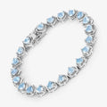 Heart Blue Topaz Prong Silver Tennis Bracelet by Fine Color Jewels