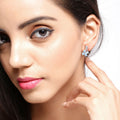 0.96 Ct Pear Blue Aquamarine & Lab Diamond Prong Silver Flower Drop Earrings by Fine Color Jewels