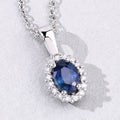 0.55 Ct oval Blue Sapphire and Lab Diamond prong Silver Halo pendant Necklace by Fine Color Jewels