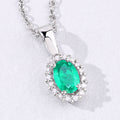 0.44 Ct oval green Zambian Emerald and Lab Diamond prong Silver Halo pendant Necklace by Fine Color Jewels