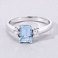 0.80 Ct Octagon Blue Aquamarine and Lab Diamond Prong Silver Three Stone Ring by Fine Color Jewels