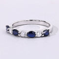 0.80 Ct Pear Blue Sapphire and Lab Diamond Prong Silver Seven Stone Half Eternity Ring by Fine Color Jewels