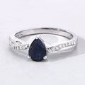 0.80 Ct Pear Blue Sapphire and Lab Diamond Prong Silver Pave Crossover Ring by Fine Color Jewels