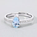 0.80 Ct Pear Blue Aquamarine and Lab Diamond V-Prong Silver Pave Bridge Ring by Fine Color Jewels