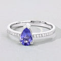 0.78 Ct Pear Violet Tanzanite and Lab Diamond V-Prong Silver Pave Bridge Ring by Fine Color Jewels