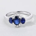 0.99 Ct Oval Blue Sapphire and Lab Diamond Prong Silver Three Stone Cocktail Ring by Fine Color Jewels
