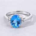 2 Ct Oval Swiss Blue Topaz and Lab Diamond Prong Silver Cocktail Ring by Fine Color Jewels