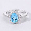 1.60 Ct Oval Swiss Blue Topaz and Lab Diamond Prong Silver Halo Pave Ring by Fine Color Jewels