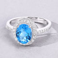 2 Ct Oval Swiss Blue Topaz and Lab Diamond Prong Silver Halo Pave Ring by Fine Color Jewels