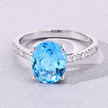2.55 Ct Oval Swiss Blue Topaz & Lab Diamond Silver Pave Bridge Ring by Fine Color Jewels