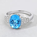 2.55 Ct Oval Swiss Blue Topaz & Lab Diamond Prong Silver Bridge Ring by Fine Color Jewels