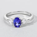 0.75 Ct Oval Violet Tanzanite and Lab Diamond Prong Silver Three Stone Ring by Fine Color Jewels