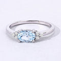 0.60 Ct Oval Blue Aquamarine and Lab Diamond Prong Sterling Silver Cocktail Ring by Fine Color Jewels
