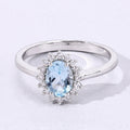 0.60 Ct Oval Blue Aquamarine and Lab Diamond Prong Sterling Silver Halo Ring by Fine Color Jewels