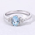 0.60 Ct Oval Blue Aquamarine and Lab Diamond Prong Silver Cocktail Ring by Fine Color Jewels