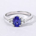0.75 Ct Oval Violet Tanzanite and Lab Diamond Prong Silver Cocktail Ring by Fine Color Jewels