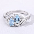 0.80 Ct Oval Blue Aquamarine and Lab Diamond Silver Bypass Promise Ring by Fine Color Jewels