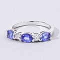 0.99 Ct Oval Violet Tanzanite and Lab Grown Diamond Prong Silver Five Stone Ring by Fine Color Jewels