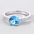 1.48 Ct Round Swiss Blue Topaz & Lab Diamond Prong Silver Pave Bridge Ring by Fine Color Jewels